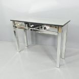 A contemporary mirrored console table with three drawers. 110x78x40cm.