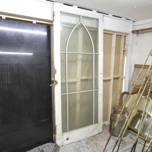 A double glazed door with lattice decoration. 94.5x215cm. Appears to be two large glass panels