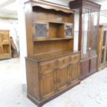 An early 20th century oak two-section dresser. 129x180x43cm. Top may not be original to base.