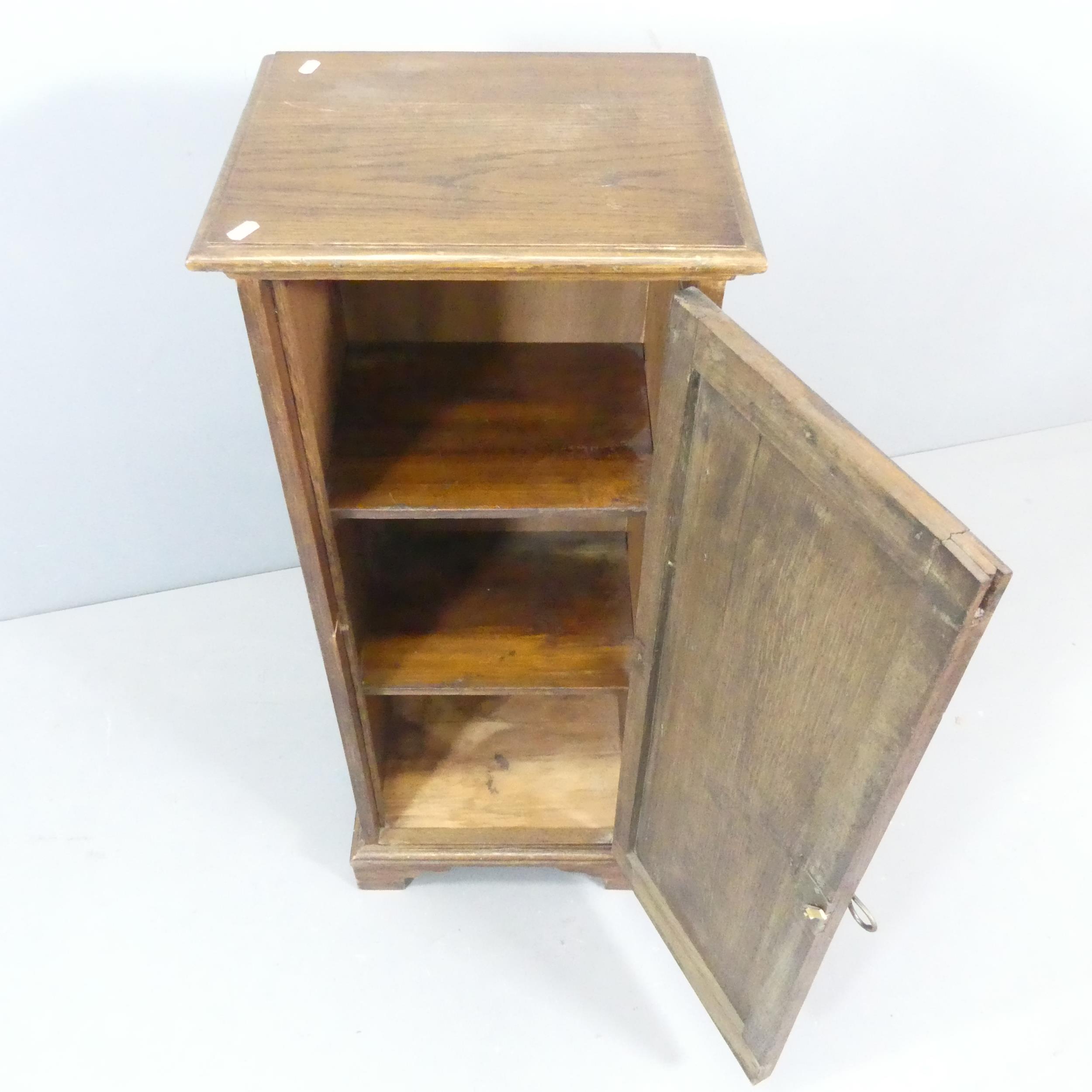 An oak Arts & Crafts style cabinet, with single door, two adjustable shelves, applied carved - Image 2 of 2
