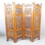 An Anglo-Indian oak four-fold room divider screen, with brass inlaid and carved and pierced