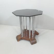 A French Art Deco style octagonal occasional table, with ebonised top and chrome supports. 46x50cm.
