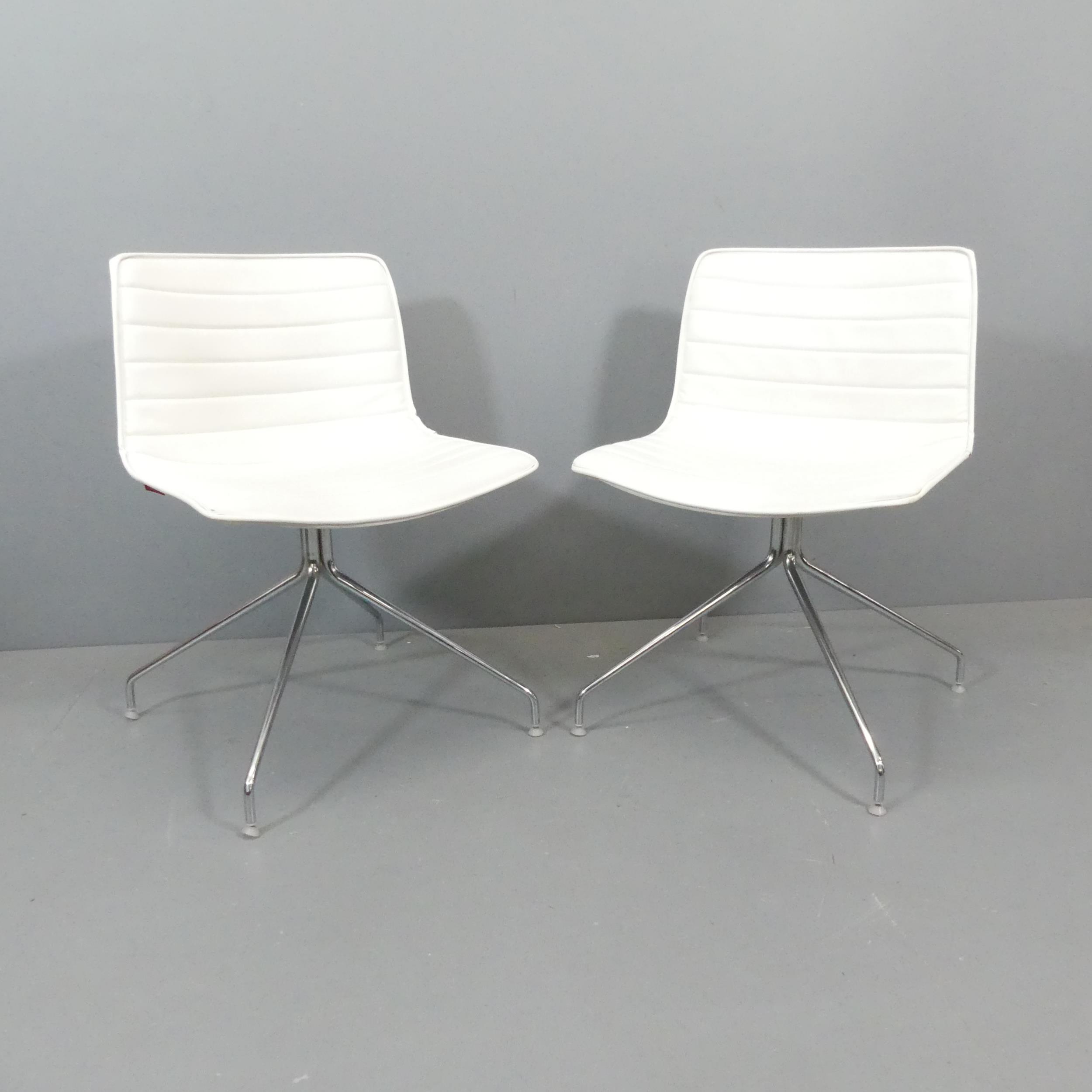 ARPER - A pair of Catifa 4 chairs in white leather, with maker's labels.