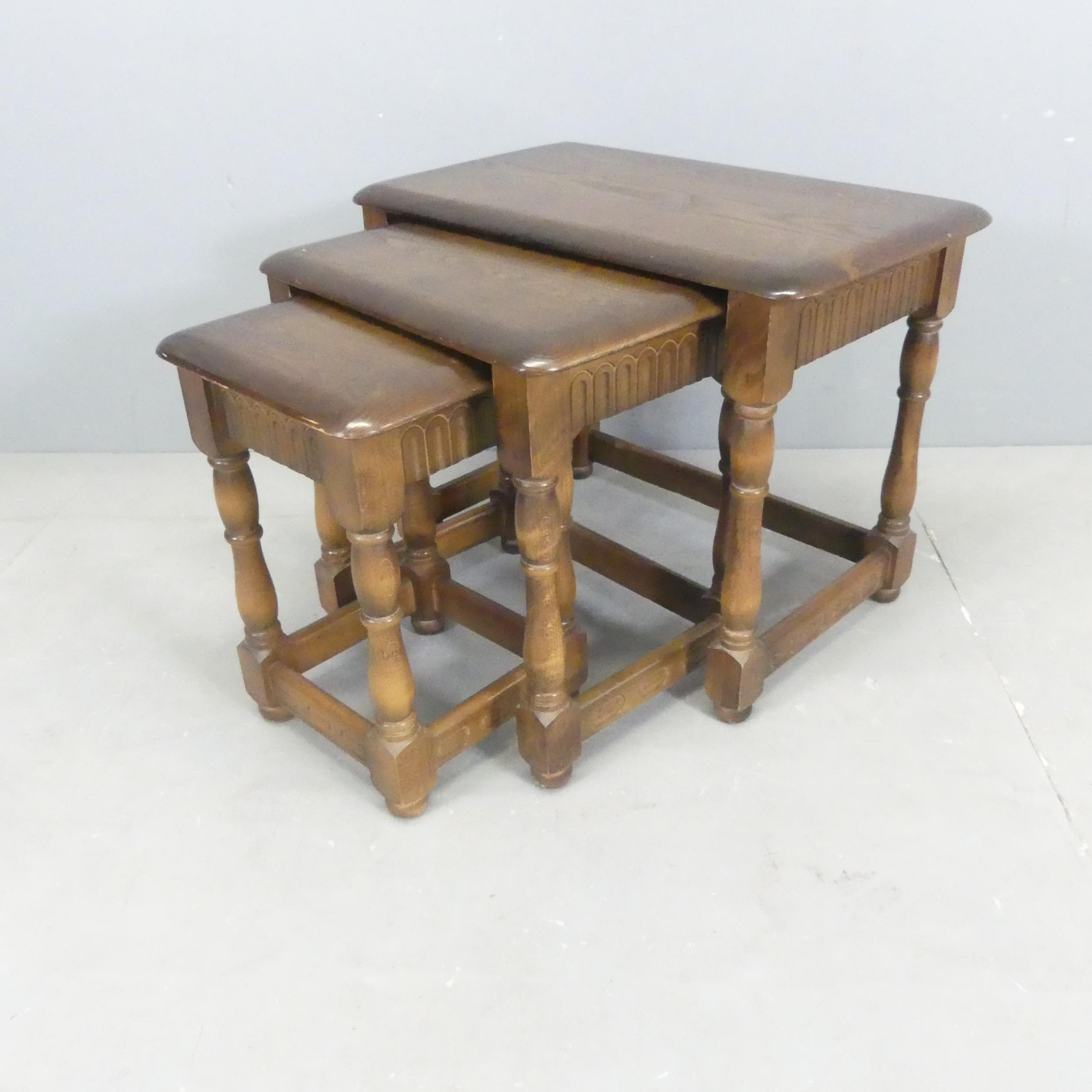 A modern nest of three oak occasional tables, largest 62x47x38cm.