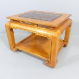 A Chinese hardwood two-tier coffee table with inset glass top. 74x54x64cm.