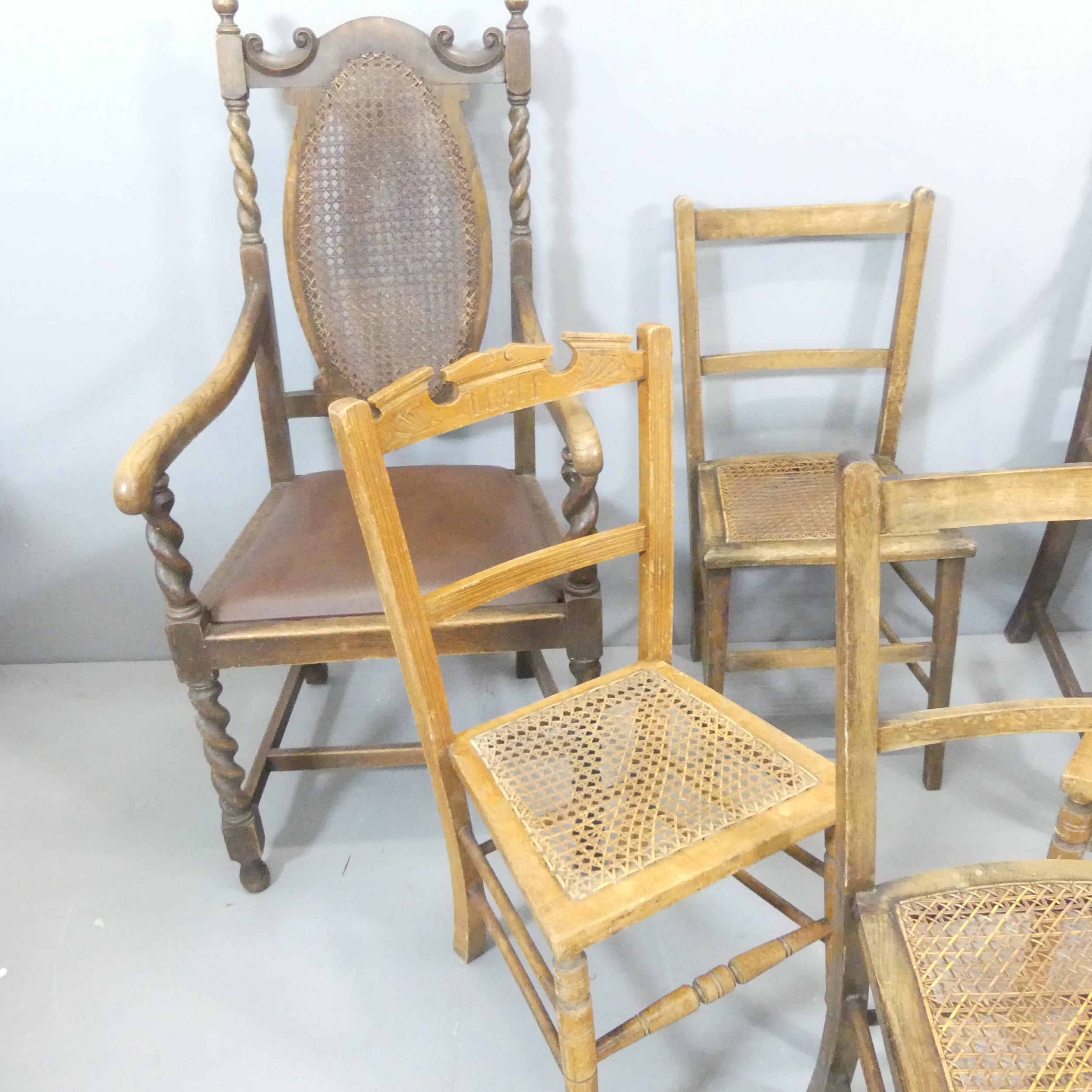 A pair of Jacobean style cane backed open arm chairs, and two pairs of cane seated dining chairs. ( - Image 2 of 2