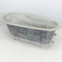 A 19th Century French faux-marble painted zinc bath, with maker's mark. 145x64x71cm. Plaque reads "
