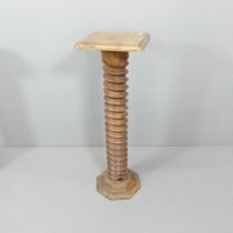 A French elm spiral turned pedestal, with oak top and base. 31x93cm.