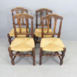 A set of four French oak rush-seated dining chairs.