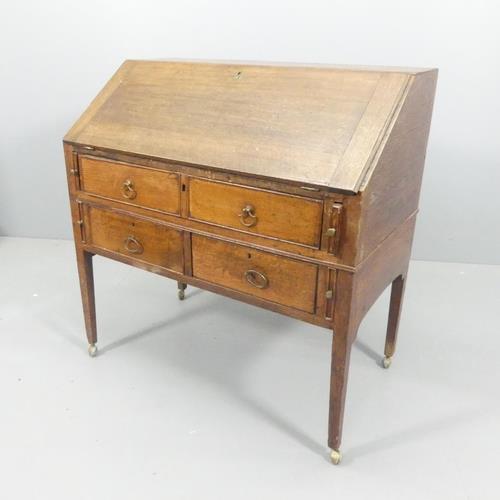 A 19th century oak bureau, the fall-front revealing a drawer fitted interior, with two long