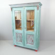 A painted pine two-door larder cupboard, with shelf fitted interior. 119x176x52cm.