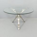 A contemporary designer cast aluminium and glass coffee table, the base with conjoined