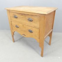 A Victorian pine low chest of two drawers, with copper Art-Nouveau style pulls. 84x79x45cm.