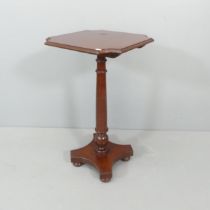 A 19th century style mahogany occasional table, on turned column with platform base. 45x81cm.