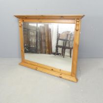 A modern pine over-mantle mirror. 95x73cm.