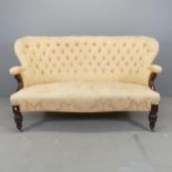 A late Victorian mahogany and button-back upholstered settee. Overall 168x93x85cm, seat 128x40x60cm.