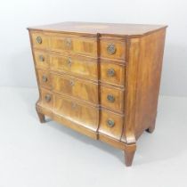 An 18th century French walnut commode chest of four drawers, with marquetry inlaid decoration and