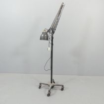 HERBERT TERRY - A mid-century floor-standing anglepoise lamp on wheeled base. With maker's mark.