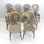 A set of eight wheelback dining chairs.
