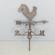 A vintage cast iron weather vane, surmounted by a cockerel. Height 90cm.