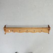 A French oak hanging pan / coat rack. Length 126cm. Height 26cm, depth 10cm.