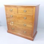 A mahogany chest of two short and three long drawers with label for Henderson Cabinet Makers,