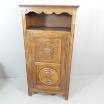 A French oak hall cupboard, with carved and panelled decoration. 87x170x48cm.