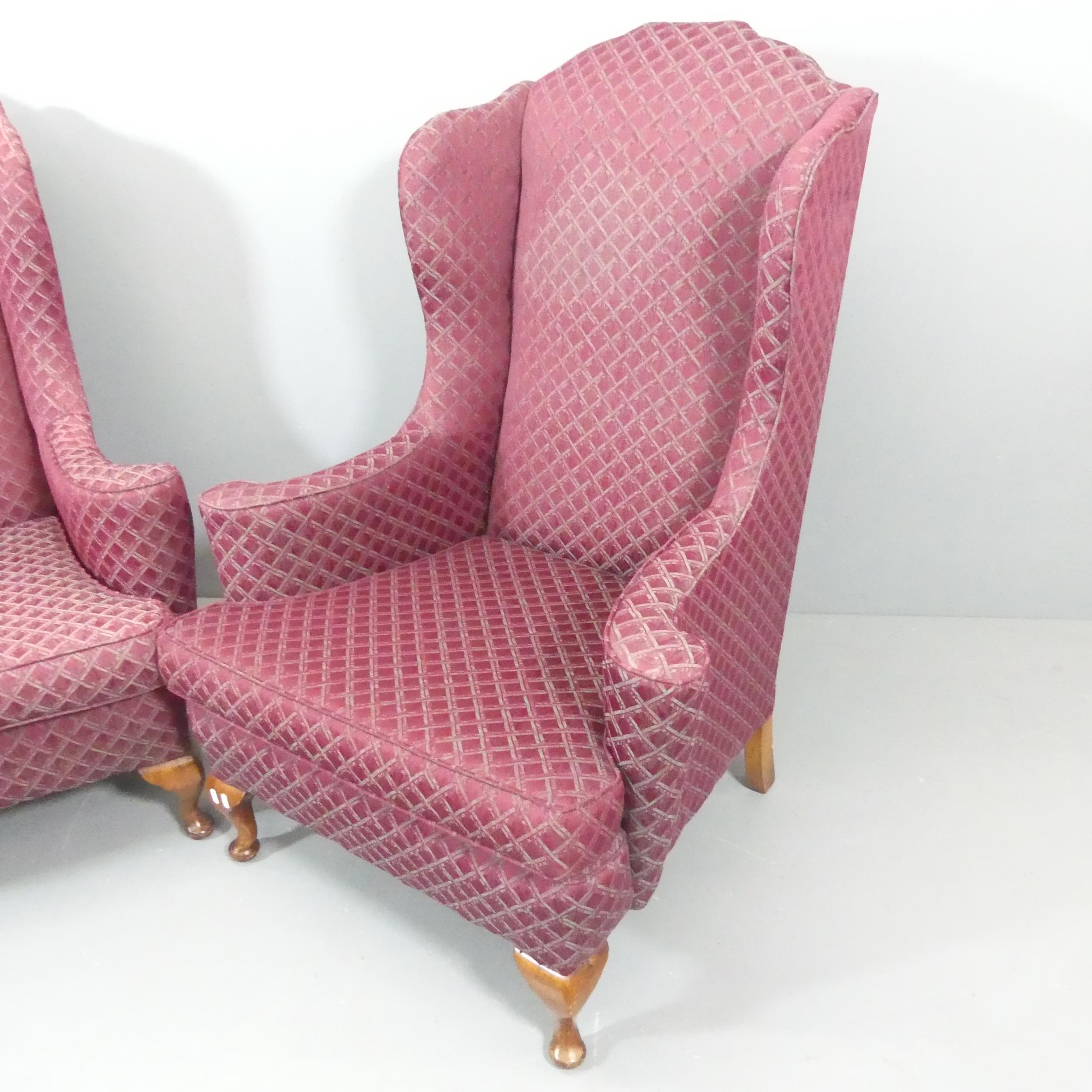 A pair of 1940s mahogany and upholstered wingback armchairs. Some marks to upholstery, and scratches - Image 2 of 2