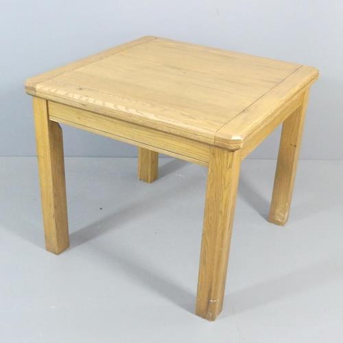 A modern light oak fold-over extending dining table. 90x90x79cm (opening to 180.5cm) Good used