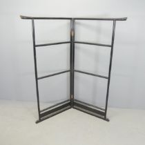 A Japanese black-lacquered folding clothes rail. Folded dimensions 76x153cm.