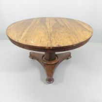 A Regency rosewood tilt-top breakfast table. 119x72cm. Some cracks and loss to veneer. The top is