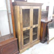 A modern Shesham two-door bookcase. 100x150x41cm.