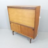 BEAVER & TAPLEY - A mid-century teak cocktail cabinet. 92x102x28cm.