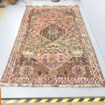 A handmade Persian Shiraz Qashqai rug with bird motifs. 265x169cm