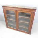 A 19th century mahogany bookcase, with two glazed doors and three adjustable shelves. 121x107.
