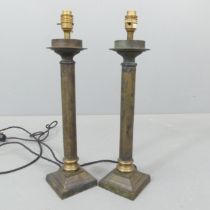 A pair of brass column table lamps. Height to bayonet 50cm.