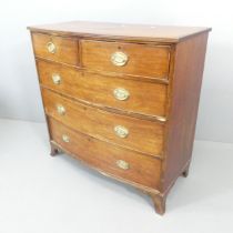 A Georgian mahogany bow-front chest of two short and three long drawers, with brass pulls