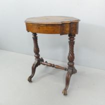 A Victorian walnut sewing table, with single frieze drawer and spiral turned supports. 61x76x48cm.