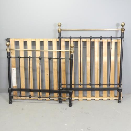 A painted iron and brass single bed. Headboard 102x128cm. Slats mounted to side rails.