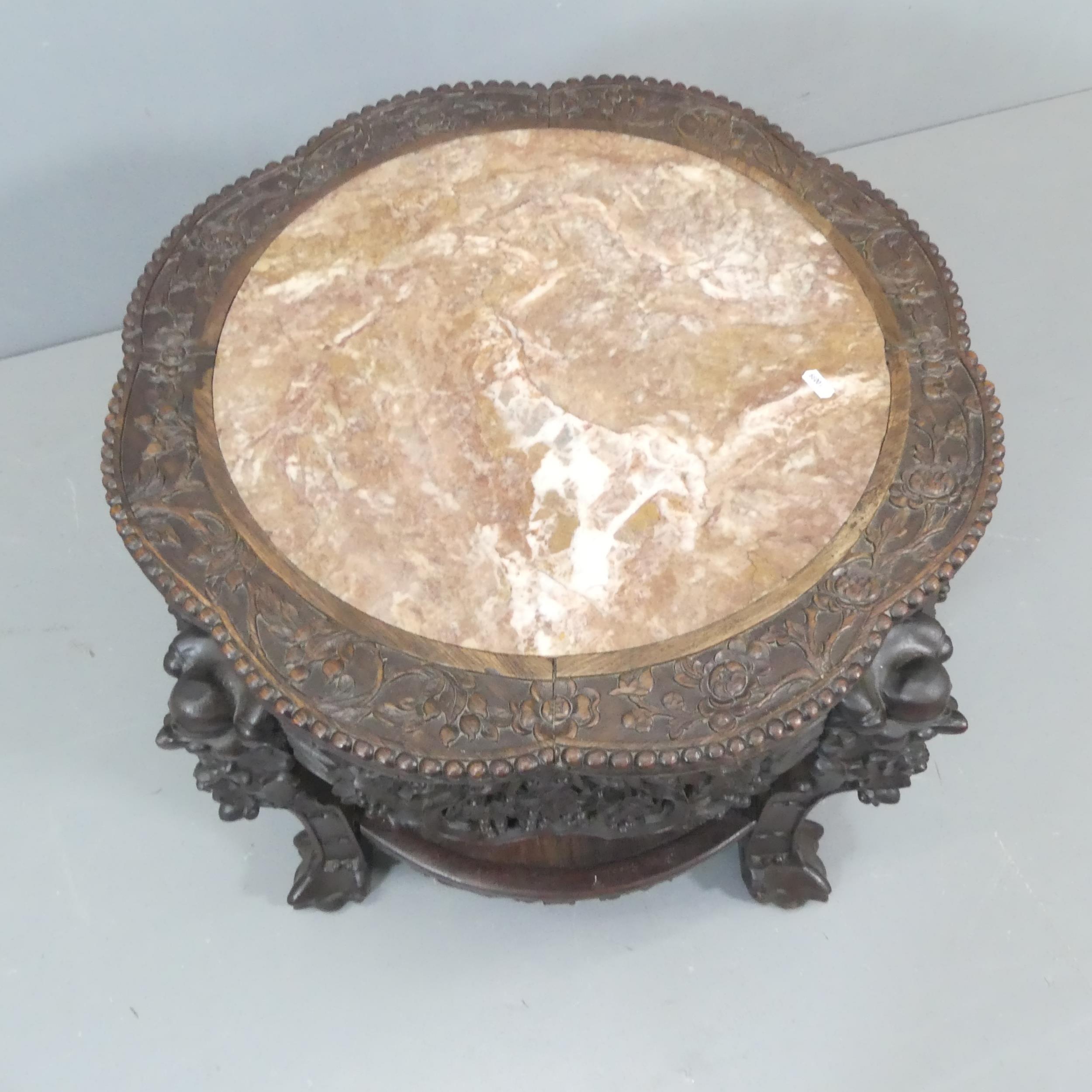 Chinese circular carved hardwood 2-tier table, with inset marble top in carved lobed surround, - Image 2 of 3