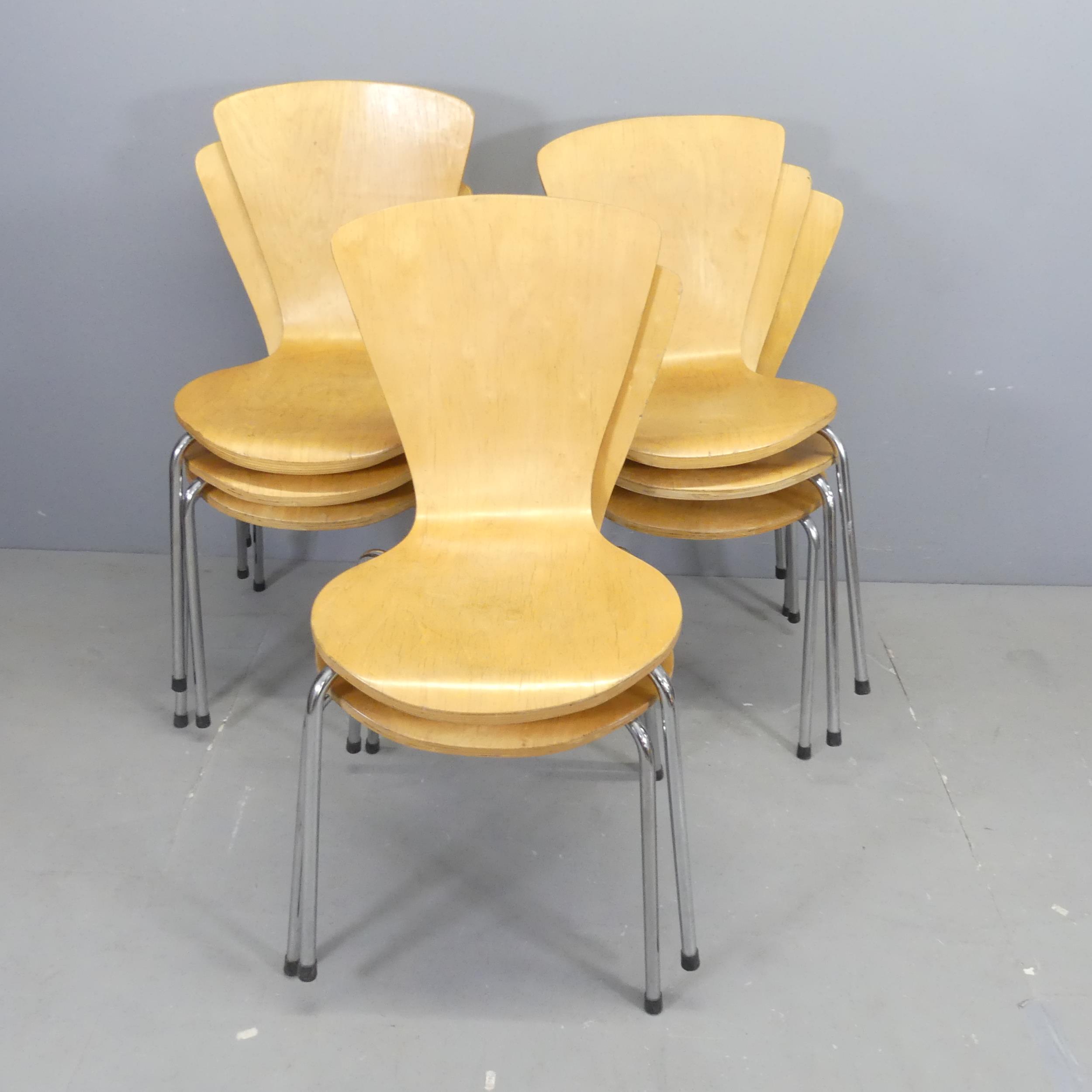 A set of eight contemporary bent ply stacking chairs.