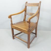 A Georgian mahogany and oak open-arm desk chair.