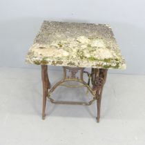 A weathered concrete garden table on cast iron treadle sewing machine base. 60x79x60cm.