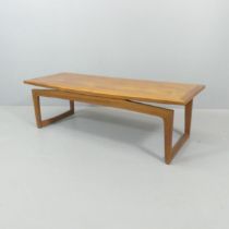 REMPLOY - A mid-century rectangular teak coffee table, with maker's label. 134x42x49cm.