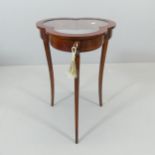 An Edwardian mahogany and satinwood strung bijouterie table of clover form. 45x69cm.