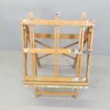 A vintage pine adjustable folding artist's easel. Height stowed 111cm. Used condition. Some wing