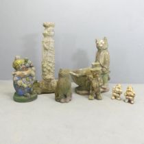 A selection of garden ornaments including a concrete cat with wheelbarrow, 57cm, clown, dwarves etc.