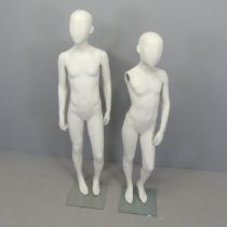 Two modern shop display mannequins, one lacking an arm. Tallest 141cm.