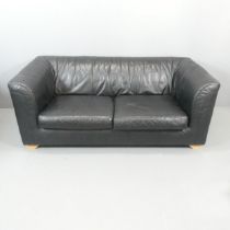 A Heal's classic black leather upholstered sofa, with original purchase receipt dated 1995.