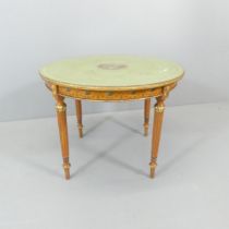 A French Louis XV style circular occasional table, with satinwood veneered frame, painted decoration